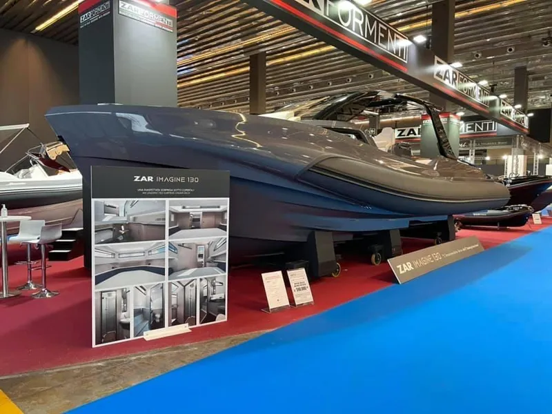 The Image of 2024 Zar Formenti Imagine 130 luxury boat displayed at a boat show. - 0