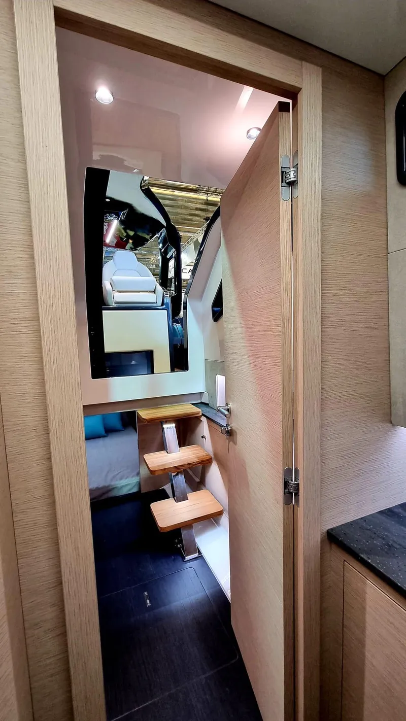 Slide: The Image of Interior view of 2024 Zar Formenti Imagine 130 yacht, featuring wooden door and modern design. - 24