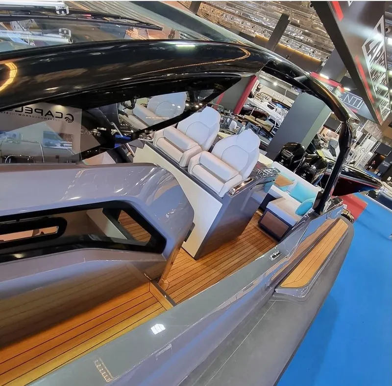 Slide: The Image of 2024 Zar Formenti Imagine 130 luxury boat interior with sleek design and comfortable seating. - 5