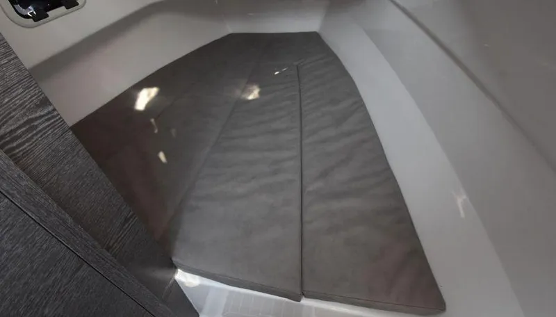 Slide: The Image of 2024 Zar Formenti 95SL boat interior cabin with cushioned seating. - 3