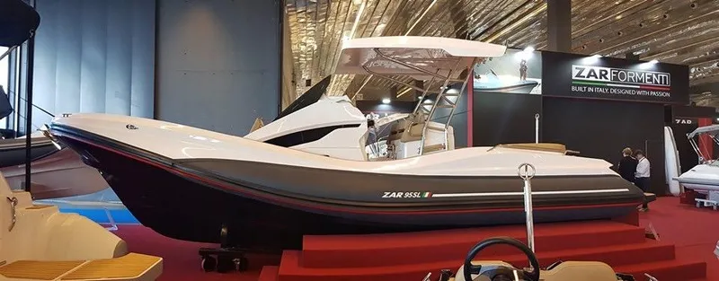 Slide: The Image of 2024 Zar Formenti 95SL boat displayed at an indoor exhibition. - 5