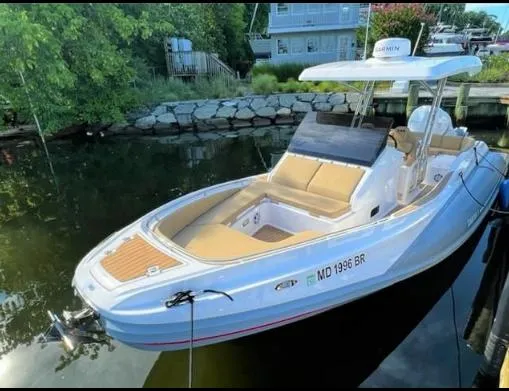 Slide: The Image of 2024 Zar Formenti 85sl boat docked in a serene marina setting. - 1