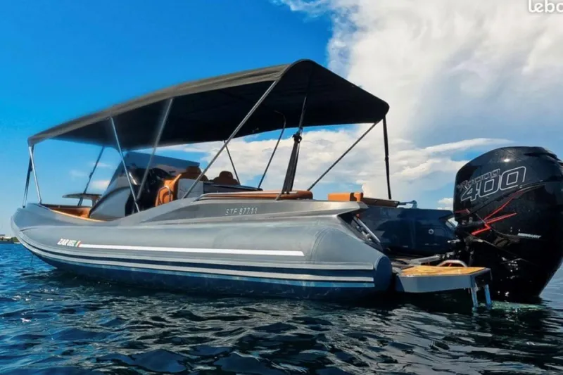 Slide: The Image of 2025 Zar Formenti 85 SL boat with canopy and powerful outboard motor on water. - 11