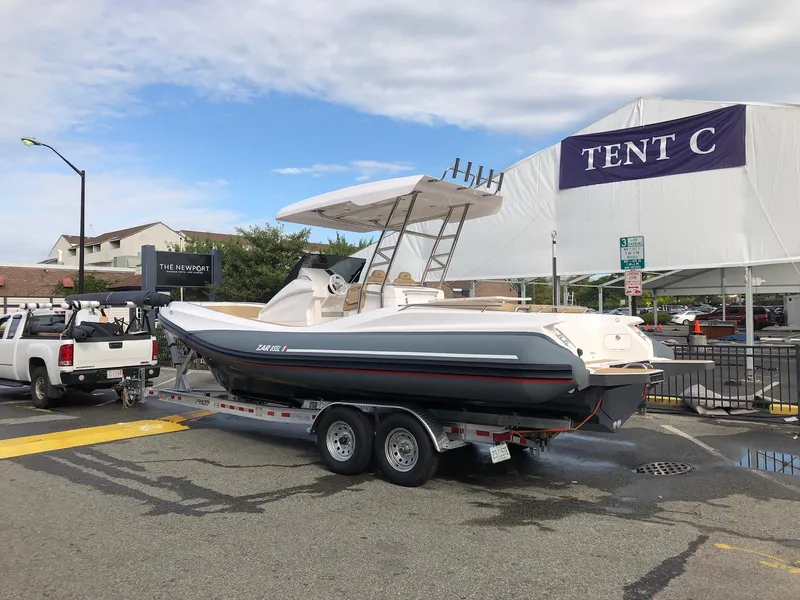 Slide: The Image of 2025 Zar Formenti 85 SL boat displayed indoors at a marine exhibition. - 4