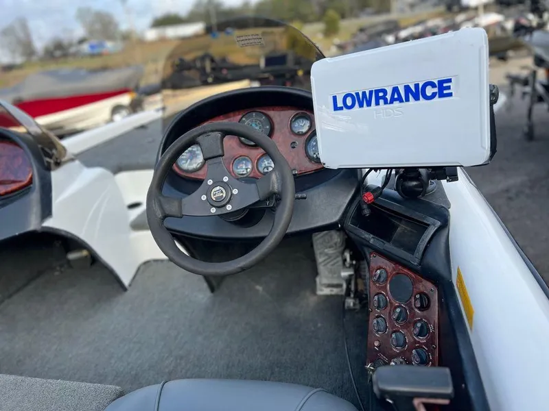 Slide: The Image of 1999 Triton TR20 boat dashboard with Lowrance GPS system. - 10