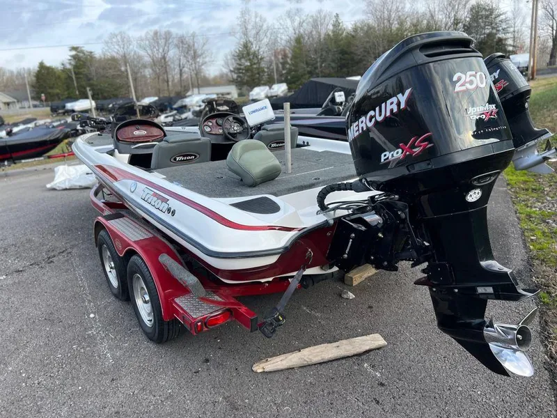Slide: The Image of 1999 Triton TR20 boat with Mercury 250 Pro XS engine on trailer. - 4