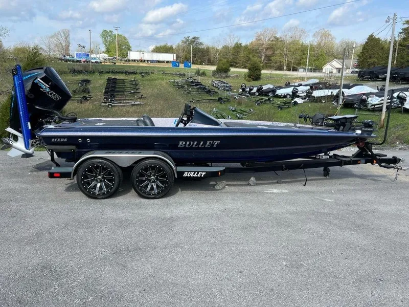 The Image of 2022 Bullet 21XRS bass boat on trailer in outdoor lot. - 0