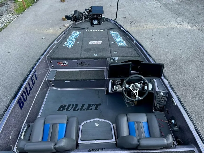 Slide: The Image of 2022 Bullet 21XRS fishing boat interior with dual seats, steering wheel, and electronic displays. - 5