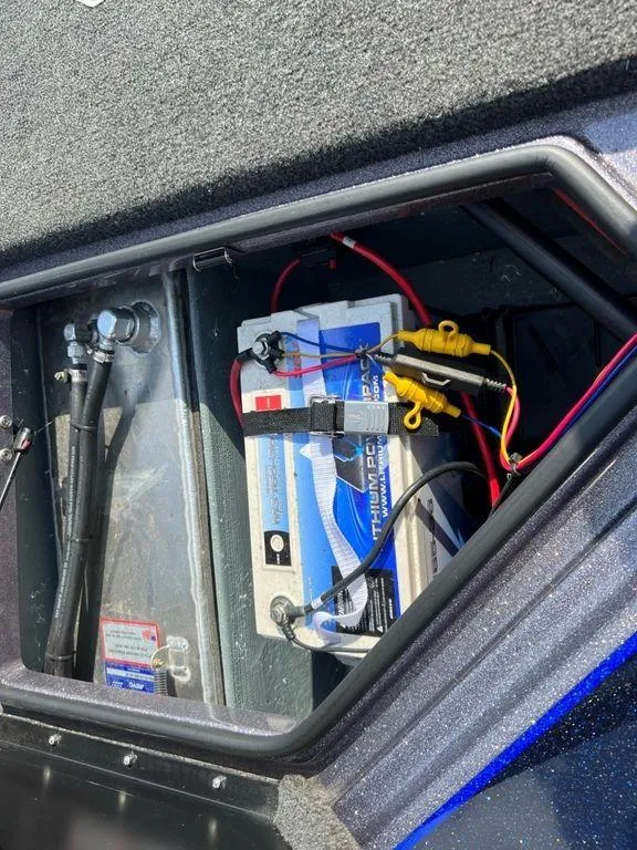Slide: The Image of Battery compartment of a 2022 Bullet 21XRS boat with wiring and connections. - 7