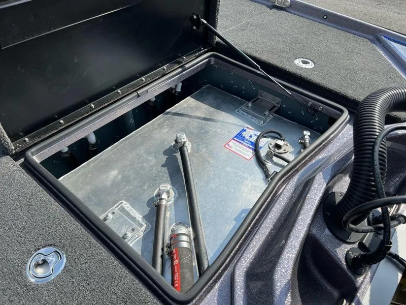 Slide: The Image of Open storage compartment of 2022 Bullet 21XRS boat showing internal components. - 8