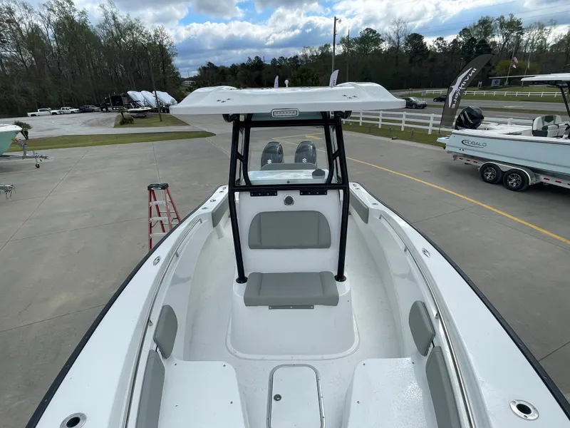 Slide: The Image of 2026 Cape Horn 24XS boat, white interior, parked outdoors, overcast sky. - 16