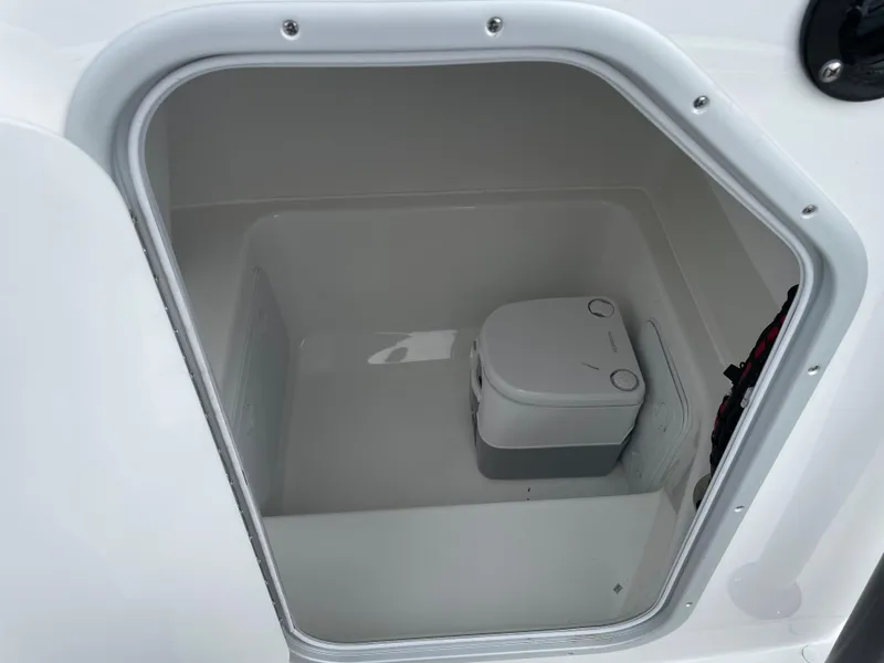 Slide: The Image of Portable toilet inside 2026 Cape Horn 24XS boat compartment. - 23