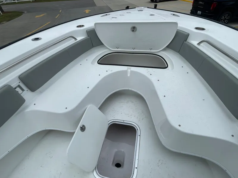 Slide: The Image of 2026 Cape Horn 24XS boat interior with storage compartments and seating. - 14