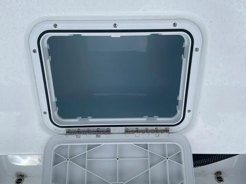Slide: The Image of Open hatch on 2026 Cape Horn 24XS boat, showcasing interior compartment. - 18