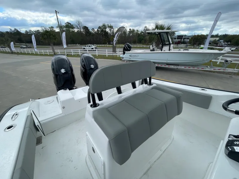 Slide: The Image of 2026 Cape Horn 24XS boat interior with dual outboard motors and seating. - 8