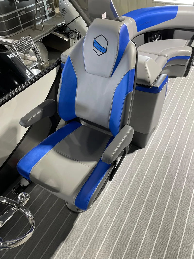 Slide: The Image of Captain's chair of 2023 South Bay 525ARCH3.0 pontoon boat with blue and gray upholstery. - 5