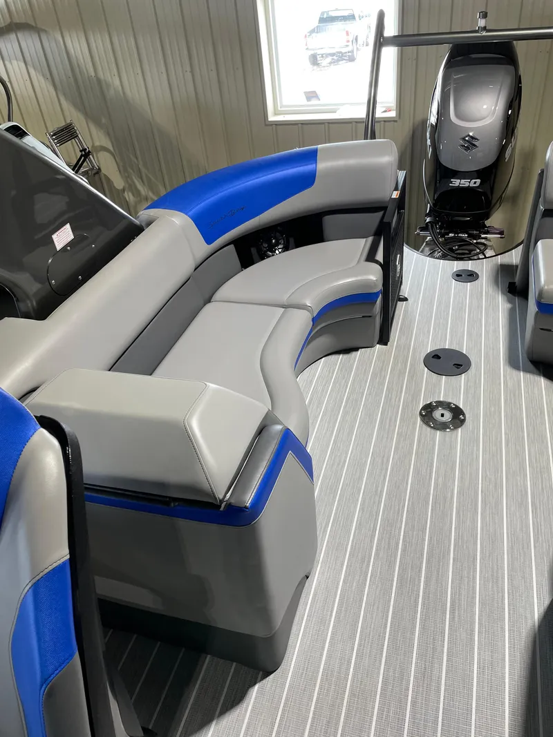 Slide: The Image of 2023 South Bay 525ARCH3.0 pontoon boat interior with gray and blue seating. - 6