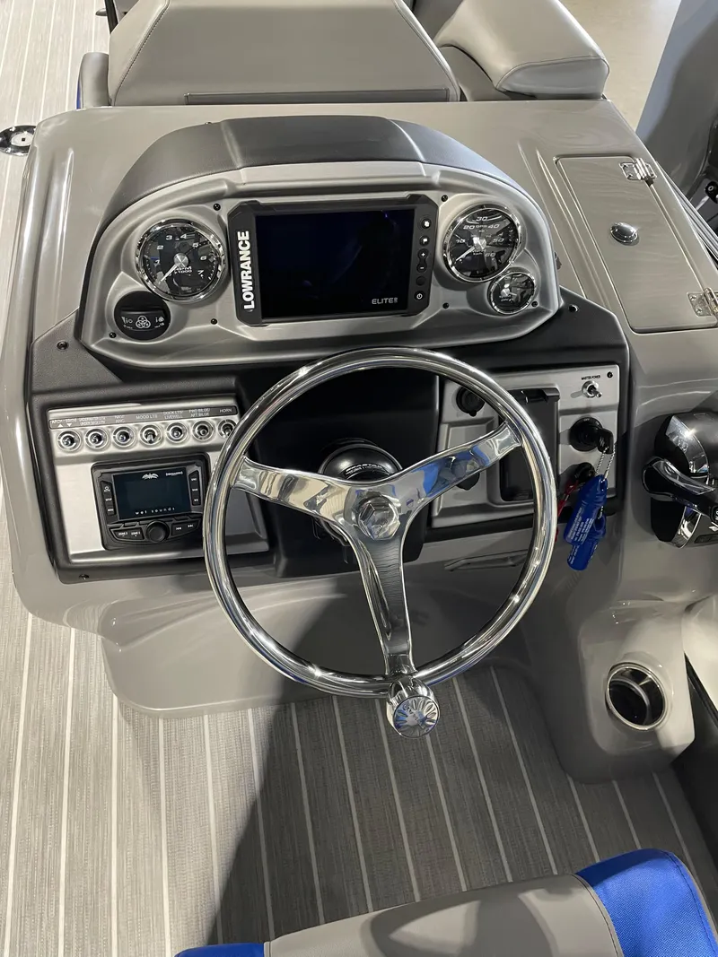 Slide: The Image of 2023 South Bay 525ARCH3.0 boat dashboard with steering wheel and navigation system. - 7