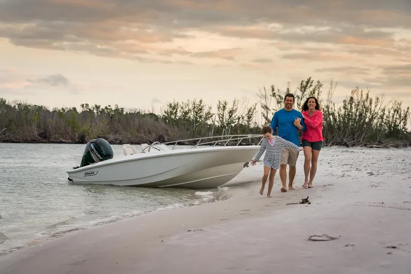 Slide: The Image of Family enjoying beach with 2024 Boston Whaler 160 Super Sport boat. - 12