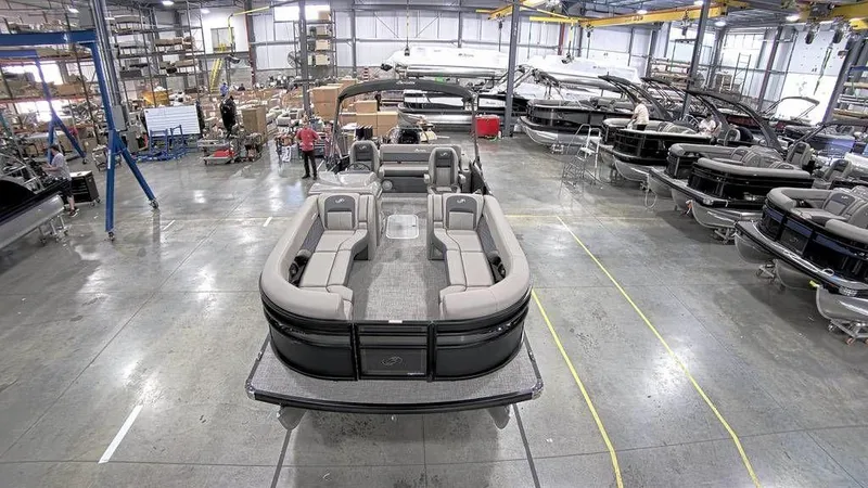 Slide: The Image of 2023 Barletta CORSA 25UC pontoon boat in a manufacturing facility. - 3
