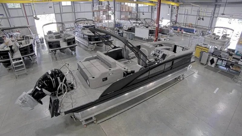 Slide: The Image of 2023 Barletta CORSA 25UC pontoon boat in a manufacturing facility. - 4
