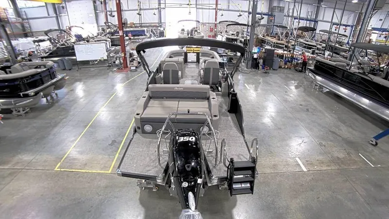 Slide: The Image of 2023 Barletta CORSA 25UC pontoon boat in a manufacturing facility. - 6