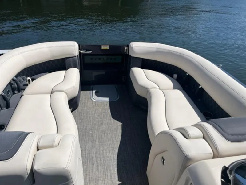 Slide: The Image of 2023 Barletta Reserve V26UC boat interior with luxurious seating on water. - 4