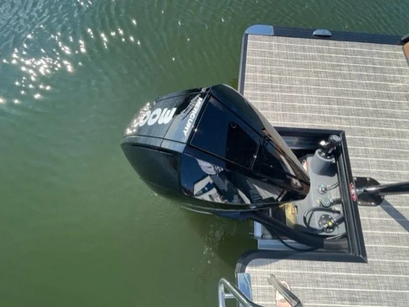 Slide: The Image of 2023 Harris Solstice DC 250 SLDH boat engine on water, top view. - 2