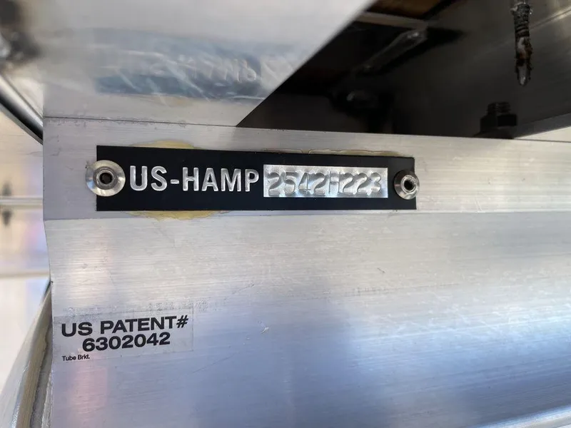 Slide: The Image of Serial number plate on 2023 Harris Sunliner 250 with US patent details. - 26