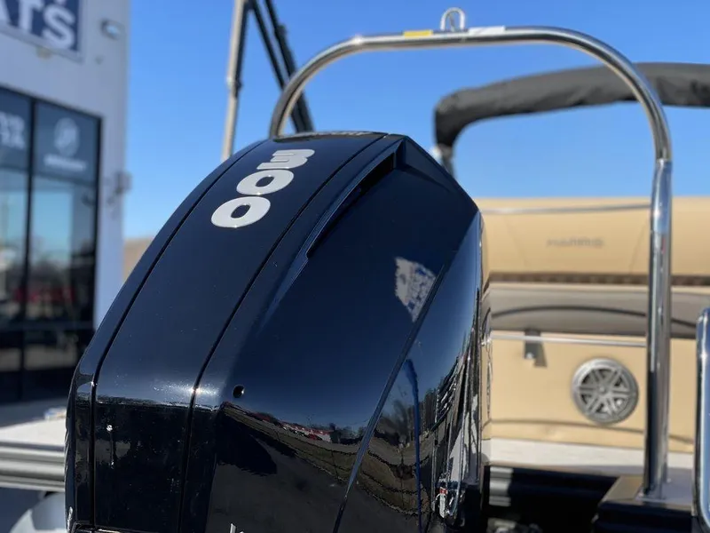 Slide: The Image of 2023 Harris Sunliner 250 boat with powerful 300 HP engine, sleek design. - 37