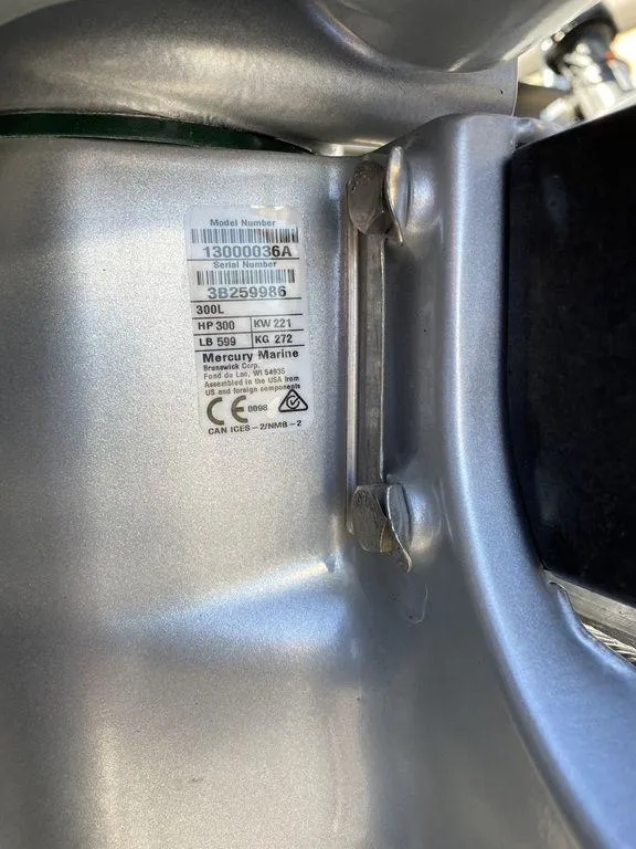 Slide: The Image of Close-up of a 2023 Harris Sunliner 250 engine label with specifications. - 9