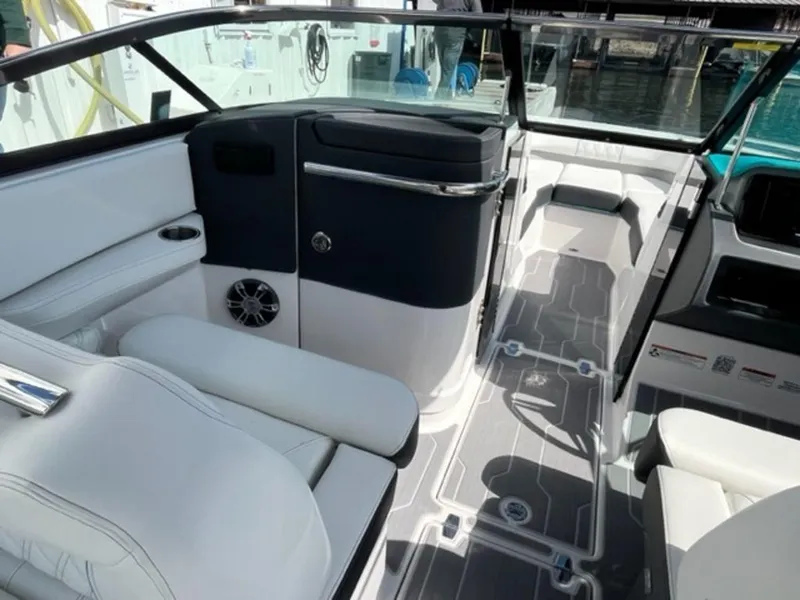 Slide: The Image of 2023 Regal LS6 Surf boat interior with sleek seating and modern design. - 13