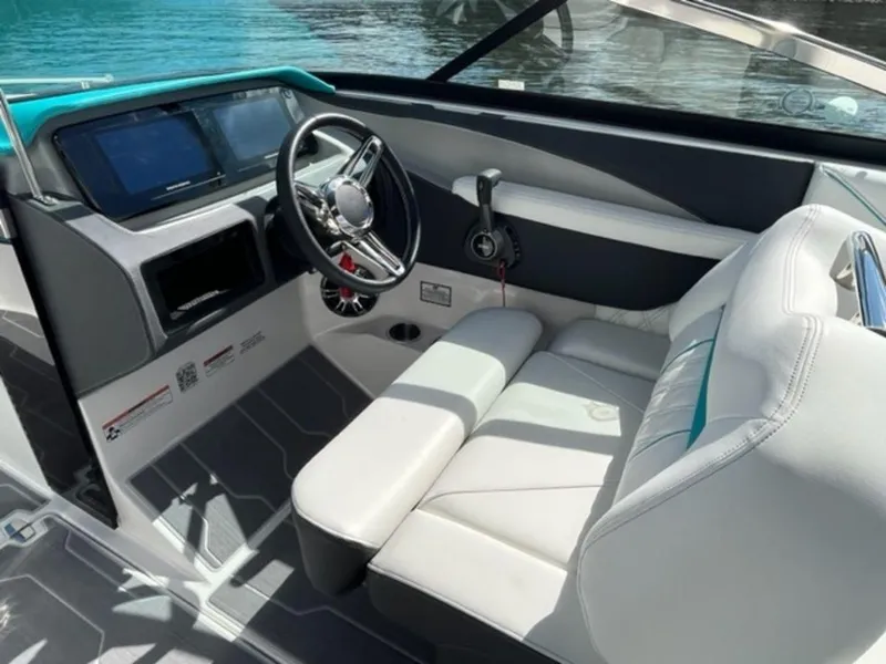 Slide: The Image of 2023 Regal LS6 Surf boat interior with modern dashboard and comfortable seating. - 3