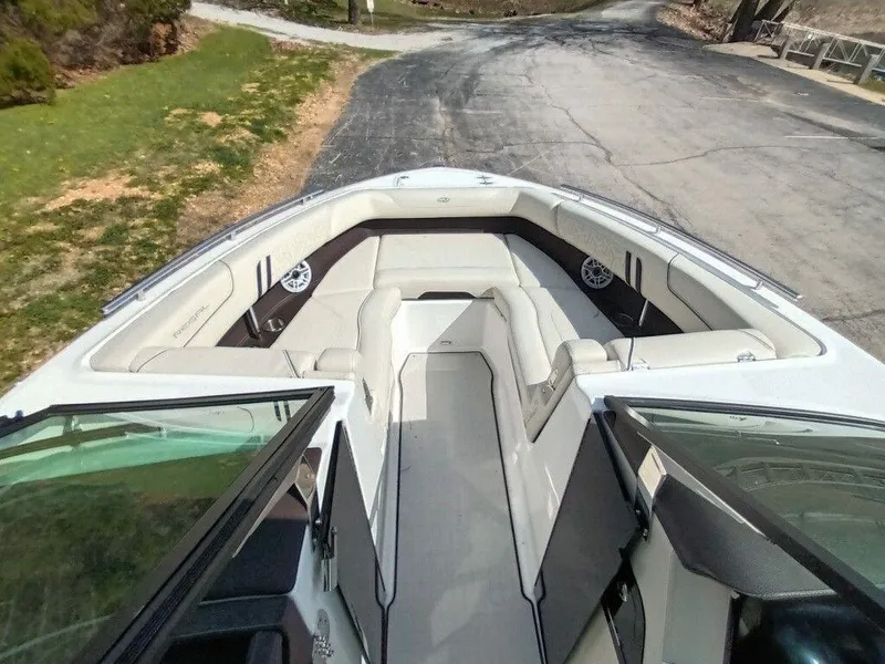 Slide: The Image of 2023 Regal LS9 Surf boat with spacious bow seating and modern design. - 13