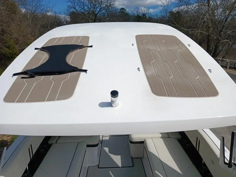 Slide: The Image of 2023 Regal LS9 Surf boat deck with seating and sun pads. - 14