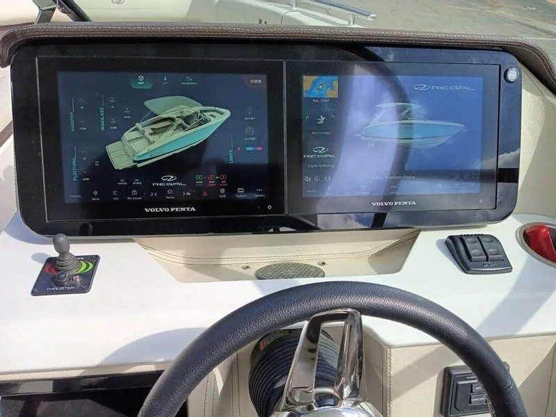 Slide: The Image of 2023 Regal LS9 Surf dashboard with dual Volvo Penta touchscreens. - 17