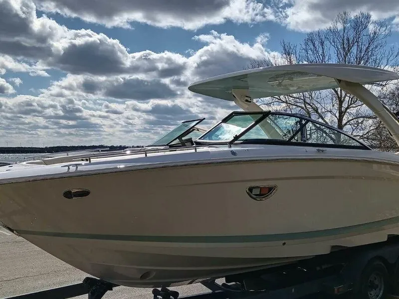 Slide: The Image of 2023 Regal LS9 Surf boat under a partly cloudy sky. - 3