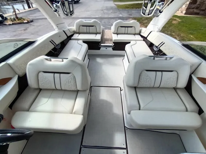 Slide: The Image of 2023 Regal LS9 Surf boat interior with luxurious white seating. - 9