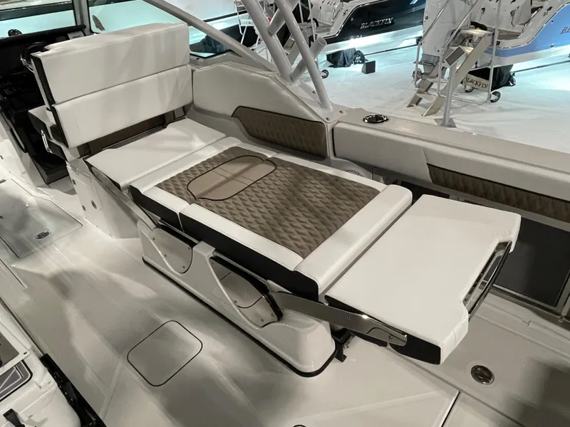 Slide: The Image of 2026 Blackfin 302 DC boat interior with adjustable seating and modern design. - 14