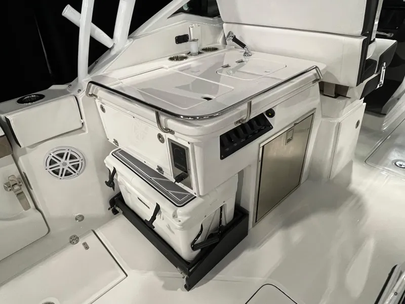 Slide: The Image of 2026 Blackfin 302 DC boat interior with storage and seating area. - 16