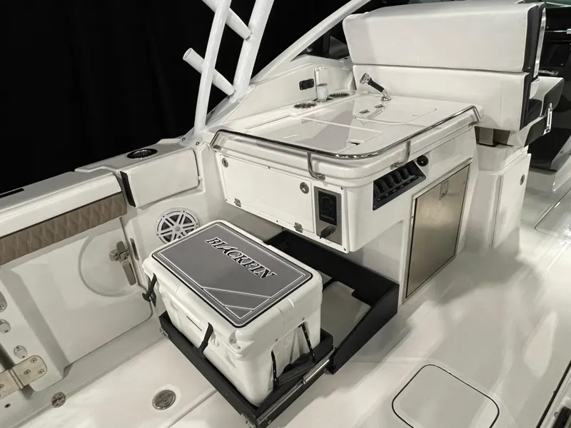 Slide: The Image of 2026 Blackfin 302 DC boat interior with seating and storage features. - 17