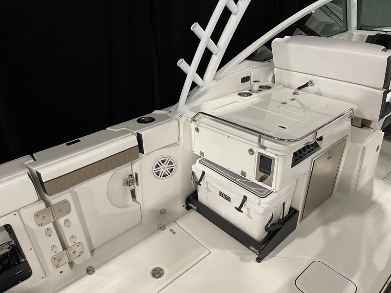 Slide: The Image of 2026 Blackfin 302 DC boat interior with seating, storage, and fishing rod holders. - 18