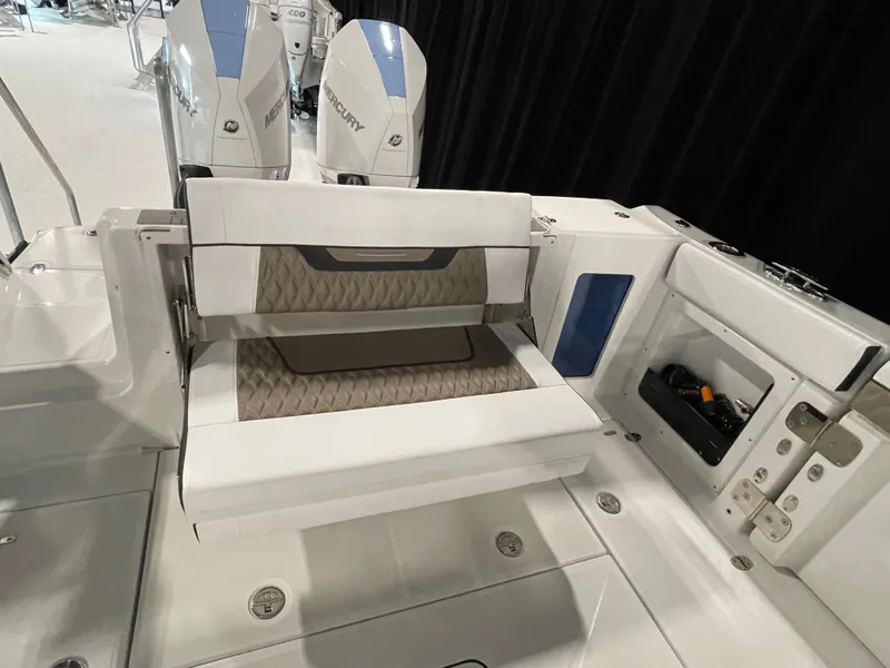 Slide: The Image of 2026 Blackfin 302 DC boat interior with seating and Mercury engines. - 19