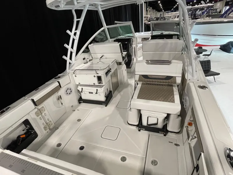Slide: The Image of 2026 Blackfin 302 DC boat interior with seating and storage compartments. - 2