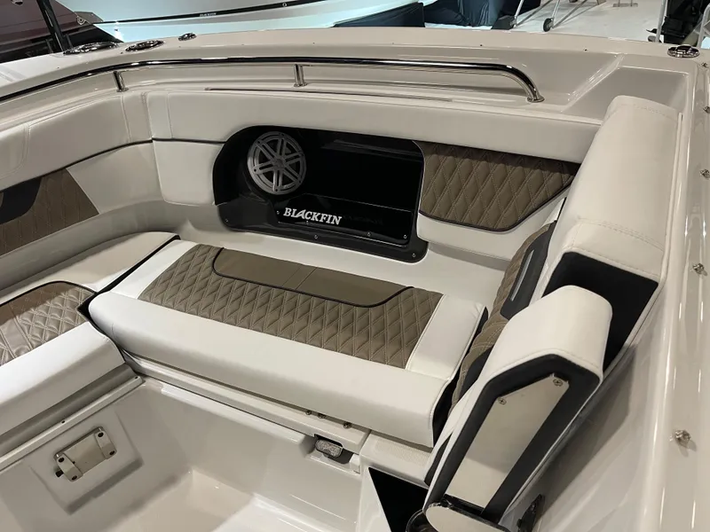 Slide: The Image of 2026 Blackfin 302 DC boat interior with luxurious seating and speaker system. - 5