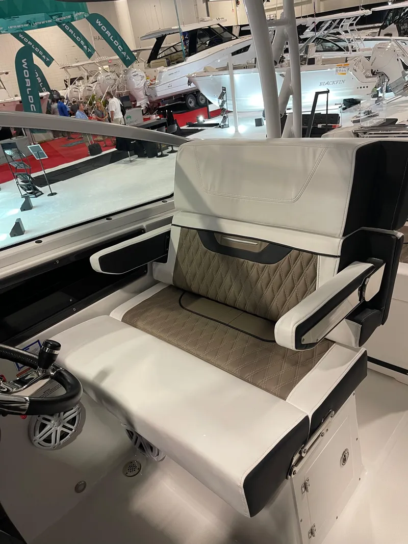 Slide: The Image of Luxury seating on 2026 Blackfin 302 DC boat at a marine exhibition. - 7