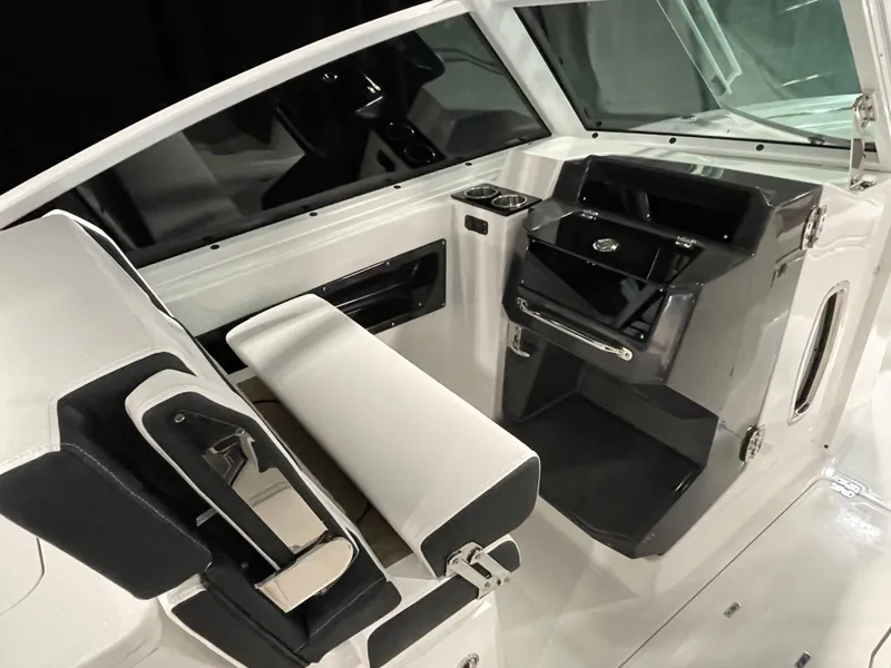 Slide: The Image of 2026 Blackfin 302 DC boat interior with sleek seating and modern dashboard design. - 8