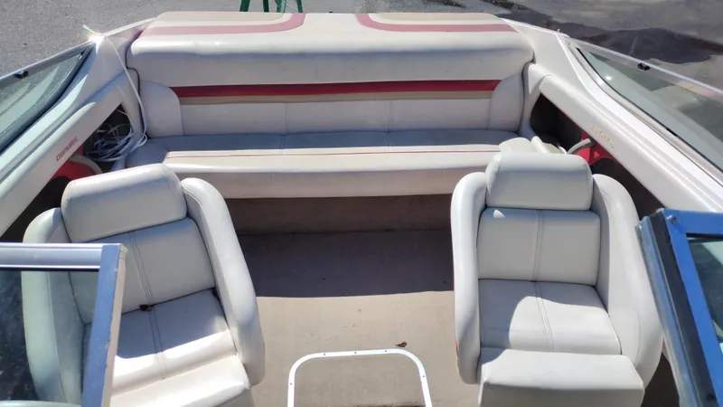 Slide: The Image of 1999 Chaparral 2130 SS boat interior with white and red seating arrangement. - 14