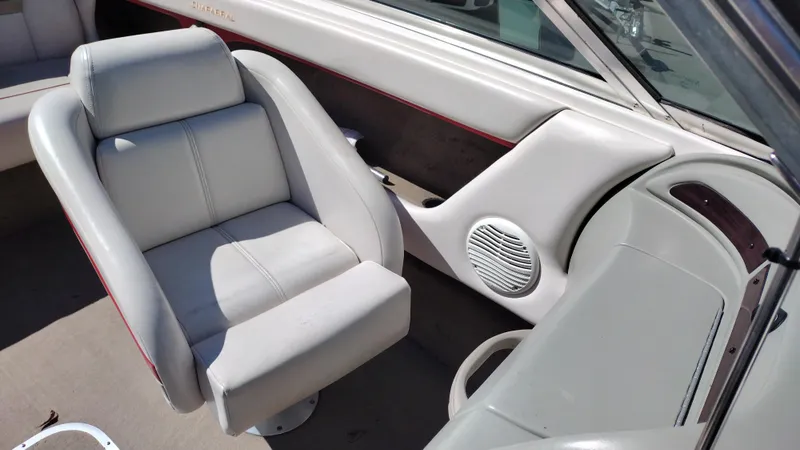 Slide: The Image of 1999 Chaparral 2130 SS boat interior with gray seating and speaker detail. - 17