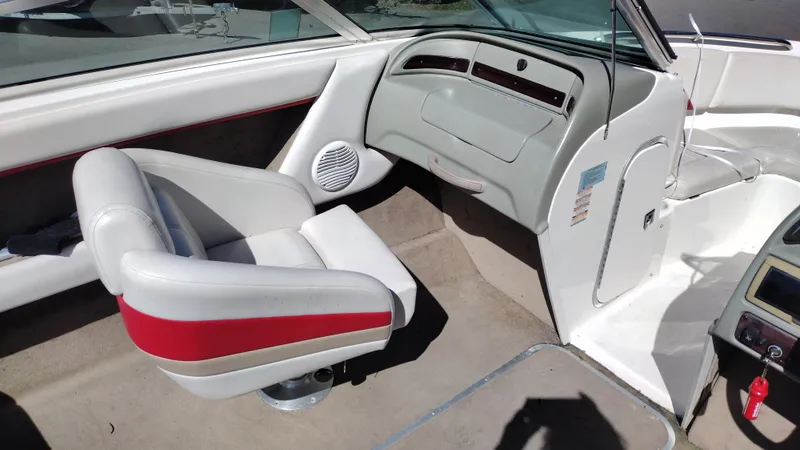 Slide: The Image of 1999 Chaparral 2130 SS boat interior with white and red seating. - 19